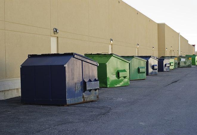 metal waste containers sit at a busy construction site in Clarkton, NC